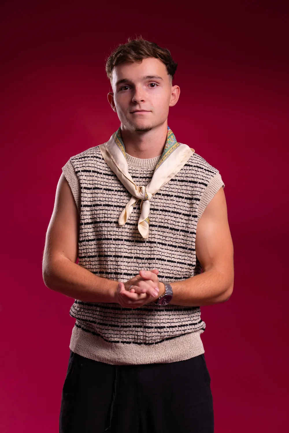 DJ Kotto (Hugo Coutinho) in a knitted vest, studio portrait